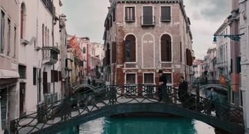 A Haunting In Venice_Poirot is followed across the bridge