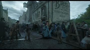 Frankenstein (2025)_Victor walks through the city to his laboratory