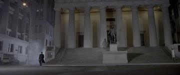 American Psycho_Bateman runs past Federal Hall