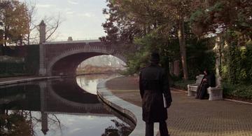 The Amityville Horror_Father Frank sits by the pond