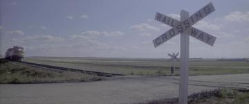 Superman (1978)_Young Clark leaps across the rain tracks