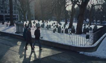The Holdovers_Hunham and Angus walk past the cemetary