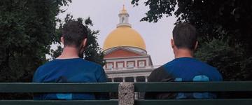 The Departed_Sullivan looks up at the State House from a bench