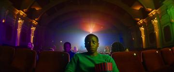 Rye Lane_Dom watches a movie in the cinema