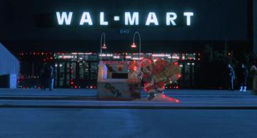 Christmas Vacation_Clark sledges into Wal-Mart
