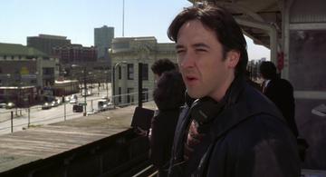 High Fidelity_Rob waits for a train