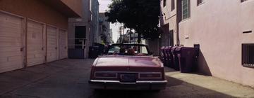 La La Land_Seb and Mia drive off down the alleyway