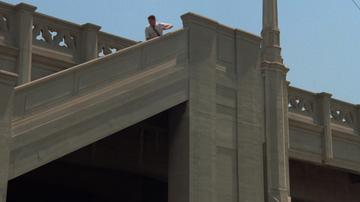 Repo Man_Otto follows the Malibu from the bridge